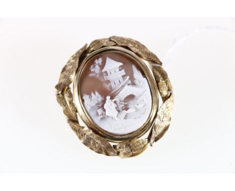 Pinchbeck cameo and moss agate swivel brooch portrait mounted within a framework of overlapping leaves. 37.85grms.
