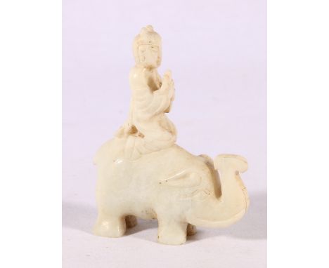 Chinese 20th Century carved jade model of a scroll bearer riding on the back of an elephant, in creamy grey white jade, 11.5c