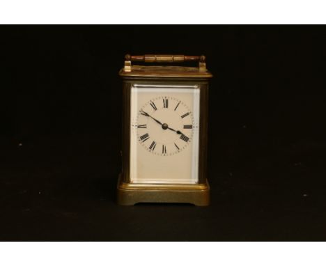 French carriage clock striking on a coiled gong in typical corniche case, 13cm tall.  CONDITION REPORT: Appears to be working