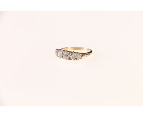 18ct gold five stone diamond ring, the central stone approximately 0.25ct, size K 2.4 grms.