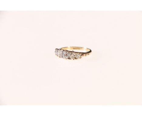 18ct gold five stone diamond ring, the central stone approximately 0.25ct, size K 2.4 grms.