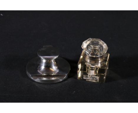 Edward VII silver capstain inkwell possibly Cohen and Charles, Chester 1908 and a glass inkwell with white metal collar. (2)