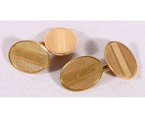 Pair of 18ct gold engine turned cufflinks. 10 grms.