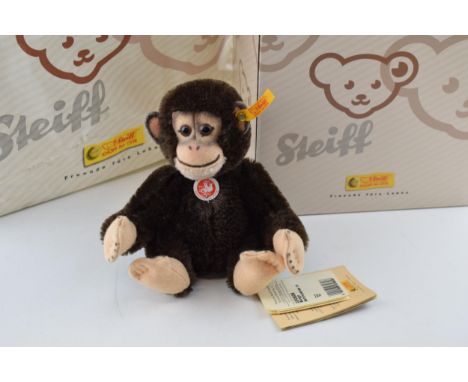 Boxed Steiff Bongo chimpanzee with Steiff paper carrier bag.