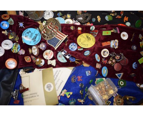 A collection of enamel badges and pin badges, cap badges and belt buckles. (Qty)