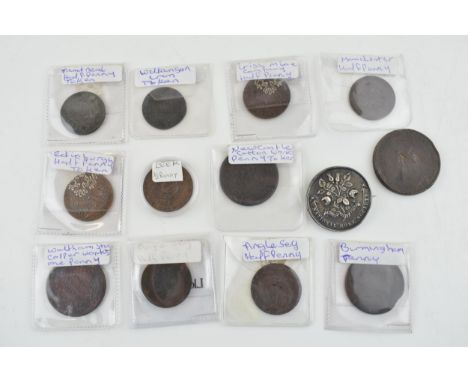 A collection of antique localised coins and tokens to include a Leek half penny, a Newcastle Cotton Works Penny, an Anglesey 