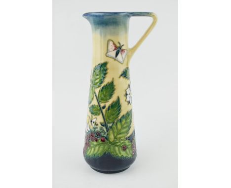Moorcroft ewer / jug decorated with honey boy design, 'Fruit Garden', 24cm tall (silver line).  In good condition with no obv