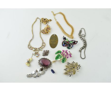 A collection of vintage costume jewellery to include brooches, necklaces, silver item noted together with a brass key fob 'Bu