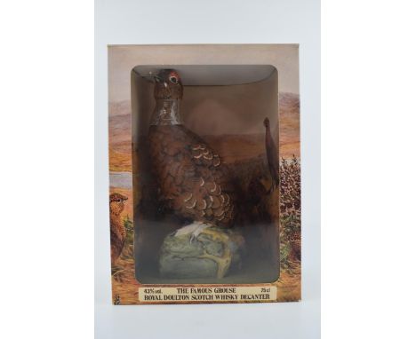 Royal Doulton Scotch Whisky Decanter of "The Famous Grouse" boxed.  In good condition with no obvious damage or restoration.