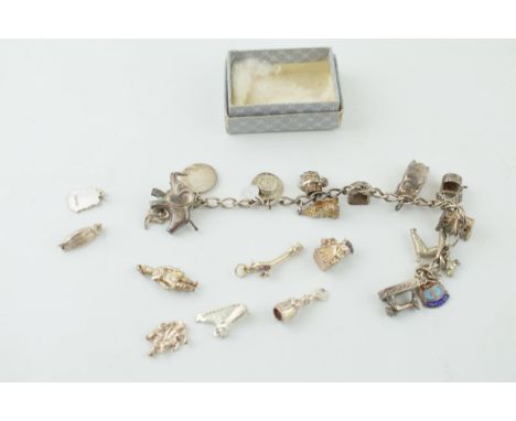 A silver charm bracelet together with a quantity of loose charms. 56.9 grams.