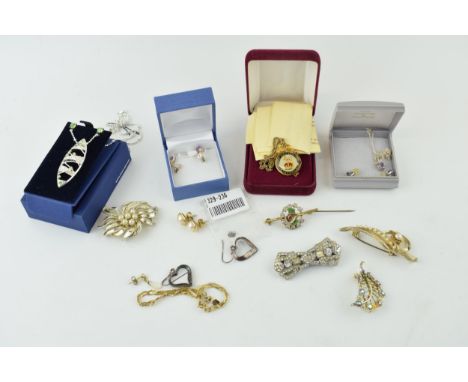 A collection of silver and costume jewellery to include gold on silver bracelet, silver heart earrings, gold plated on silver