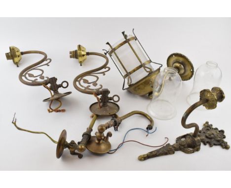 A collection of vintage and antique brass lighting and lamp fixtures and fittings, to include wall sconces in an Art Nouveaux