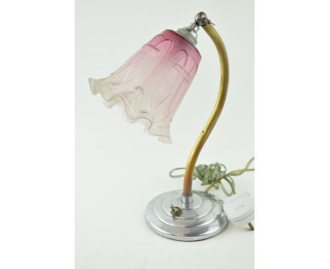 An Art Deco side lamp on chrome circular base with brass arm and adjustable glass shade. Height 32cm.  Working but not PAT te