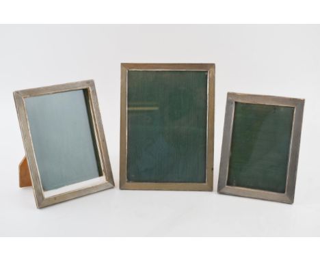 A trio of Art Deco graduated 800 silver engine turned photo frames c1930s. 15.5cm x 11.5cm, 17cm x 15.5cm, 19.5cm x 14.5cm.&n