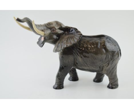 Beswick large elephant with outstretched trunk 998, 34cm long.  In good condition with no obvious damage or restoration.