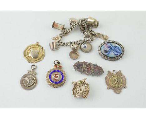 Silver to include a charm bracelet, with four silver fobs and three brooches, 117.8g.
