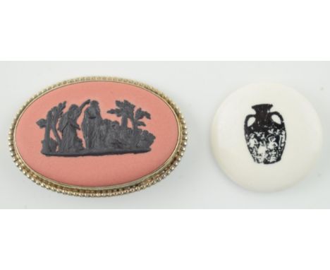 A Wedgwood Black on Terracotta brooch, gold plated on silver mount, 1958 GF, together with a ceramic button 1964 depicting th