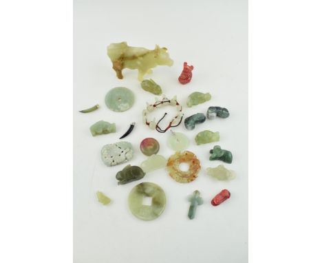 A collection of Jadeite, Jade and similar hard stone carved items to include Bi discs, animals and jewellery. (Qty)