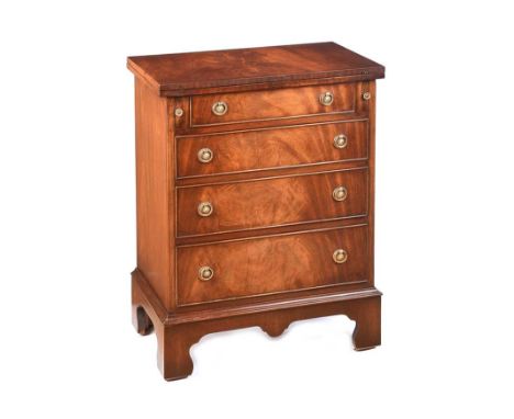 MAHOGANY FOUR DRAWER CHEST WITH BRASS RING HANDLES & HINGED LID.RAISED ON BRACKET FEET.HEIGHT: 31½ INCHES.WIDTH: 23 INCHES.DE