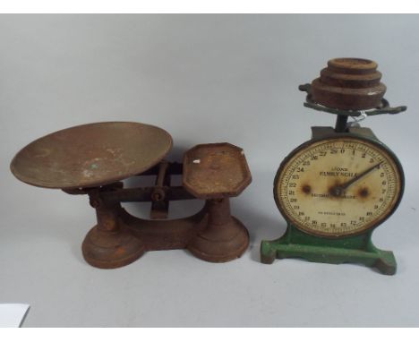 A Kitchen Scale and A Set of Scales and Weights. 