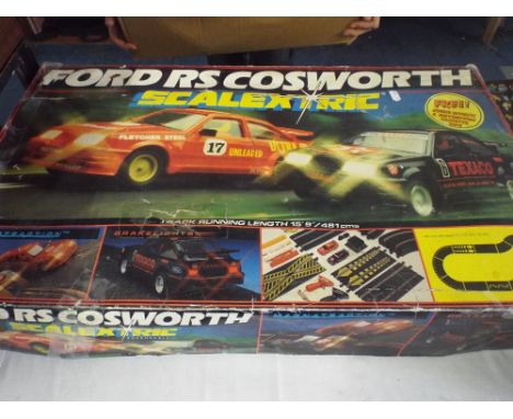A Scalextric Ford R S Cosworth Rally Set Together with Extra Track and Accessories and A Micro Scalextric Championship Set.