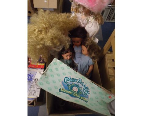 A Box Containing Dolls, Cabbage Patch Kid, Sooty Glove Puppet Etc. 