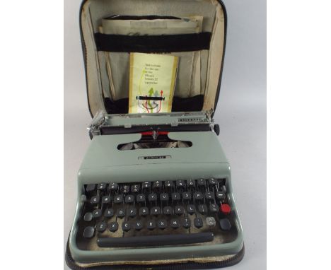 A Vintage Olivetti Lettera 22 Typewriter in Case.  
