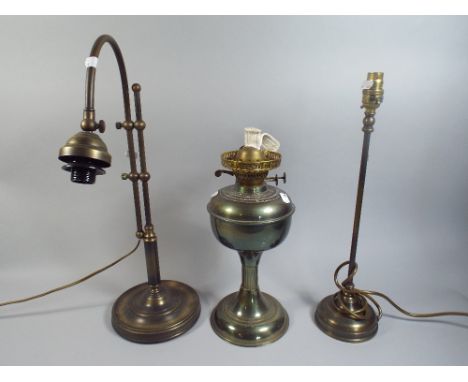 An Oil Lamp and Two Table Lamps. 