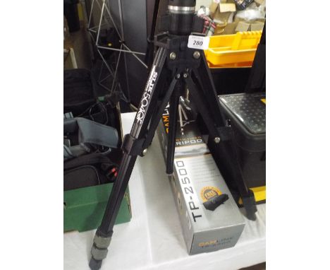 A Slik Camera Tripod. 