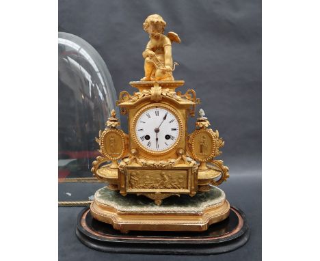 A 19th century gilt metal mantle clock with cupid surmount, the enamel dial with Roman numerals, the twin train movement stri