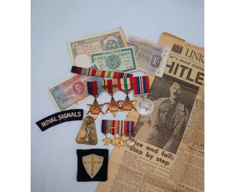 A set of four World War II medals including The 1939-1945 Star, The Africa Star, 8th Army Bar, The Italy Star and the war med