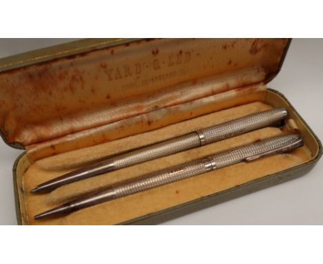 An Elizabeth II silver roller ball pen, Birmingham, 1959, E Baker &amp; Son, together with a matching propelling pencil