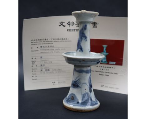 A Qianglong Qing Dynasty candlestick, with central drip tray, decorated with a dragon, 17.5cm high with a China Cultural Reli