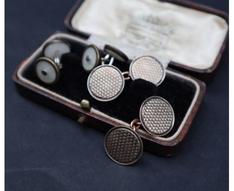 A pair of 9ct gold cufflinks of circular form with engine turned decoration,  approximately 7 grams and another pair of cuffl