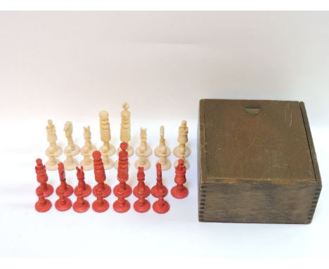 An ivory part chess set, stained red and natural, King 9cm high, one red pawn missingProvenance:  From the Estate of Stephen 