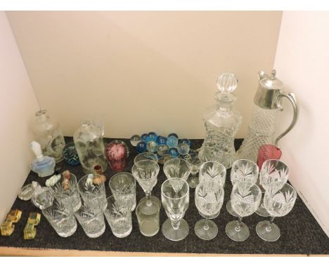 Six cut crystal wine glasses, together with a decanter and other glass ware