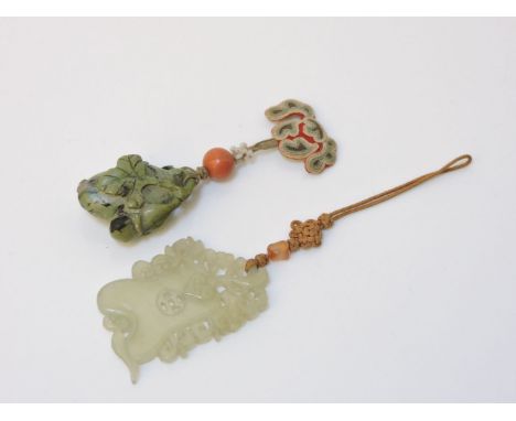 A Chinese carved jade pendant, 20th century, carved as a gourd with ruyi motif, 5.5 x 3.5cm and a soapstone pendant in the fo