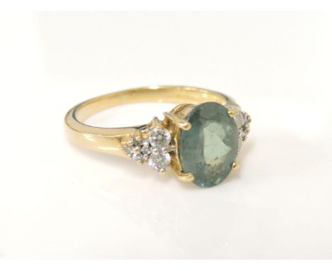 An 18ct gold oval cut chrysobery and diamond ring