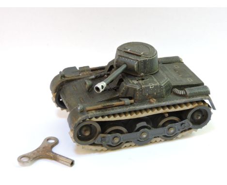 A Gama tinplate clockwork tank, with rubber tracks, twin machine guns, boxed