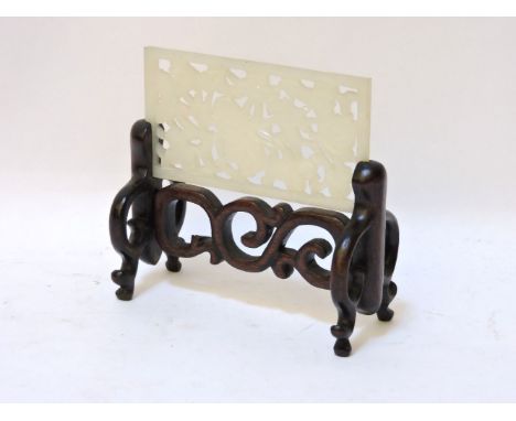 A small table screen, 20th century, the wood stand in archaic style, insert with a jade panel, pierced and carved with lotus 