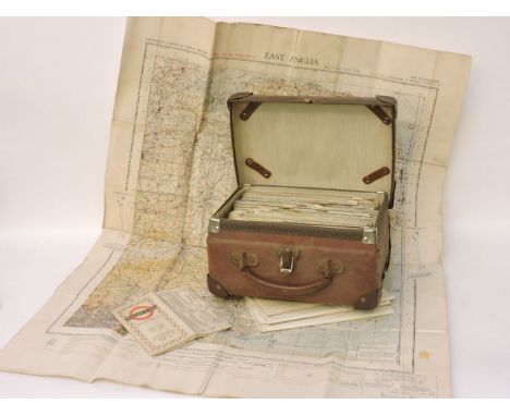 A case of World War II military ordnance survey maps 1941, un-numbered, with index card and other war editions and a trolley 