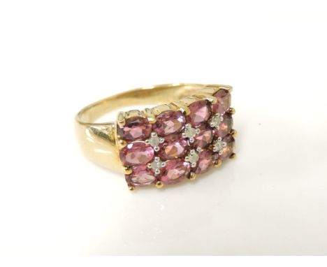 A 9ct gold three row band pink tourmaline an diamond ring, 4.0g