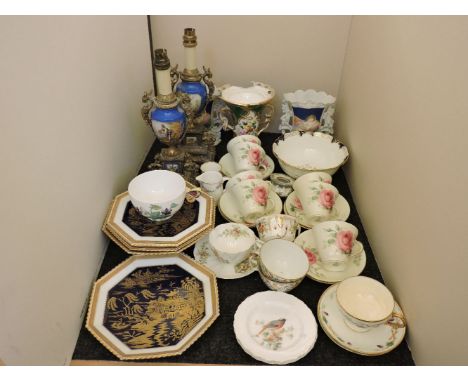 A pair of Sevres type porcelain table lamps, Royal Worcester plates by Powell, and other porcelain items