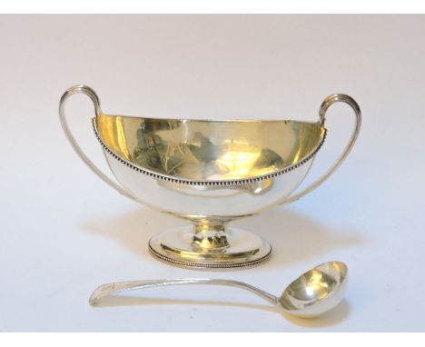 A Georgian silver navette shaped sauce tureen, with beaded rim and looped handle to either side, marks to the underside for L