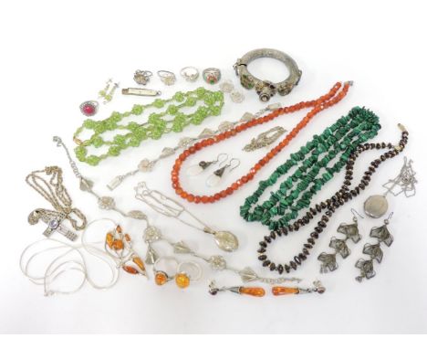 A matched suite of amber cabochon jewellery, a collection of silver and costume jewellery to include a silver locket on chain