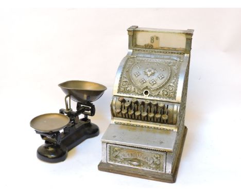 A nickel plated 19th century National cash register, patented Dayton, Ohio, on wood plinth, 26cm wide, 43cm high, and a pair 
