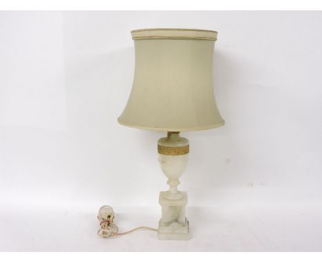 An alabaster table lamp, of urn form, with gilt metal mounts and shade, 60cm high including shade