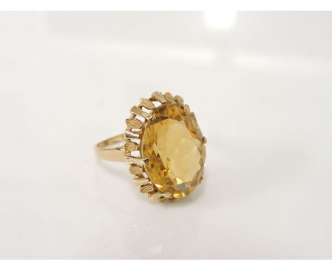 A 9ct gold oval mixed cut citrine ring,  5.02g