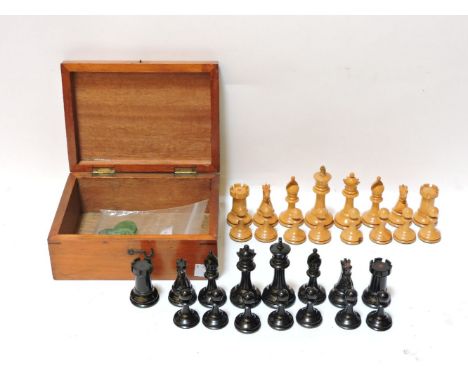 A Staughton turned wood chess set, with weighted bases, a rook and knight from each side impressed with a red crown (one blac