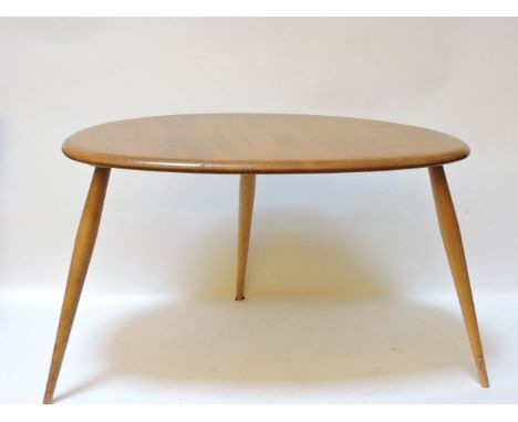 An Ercol elm occasional table, together with a nest of three Ercol tables